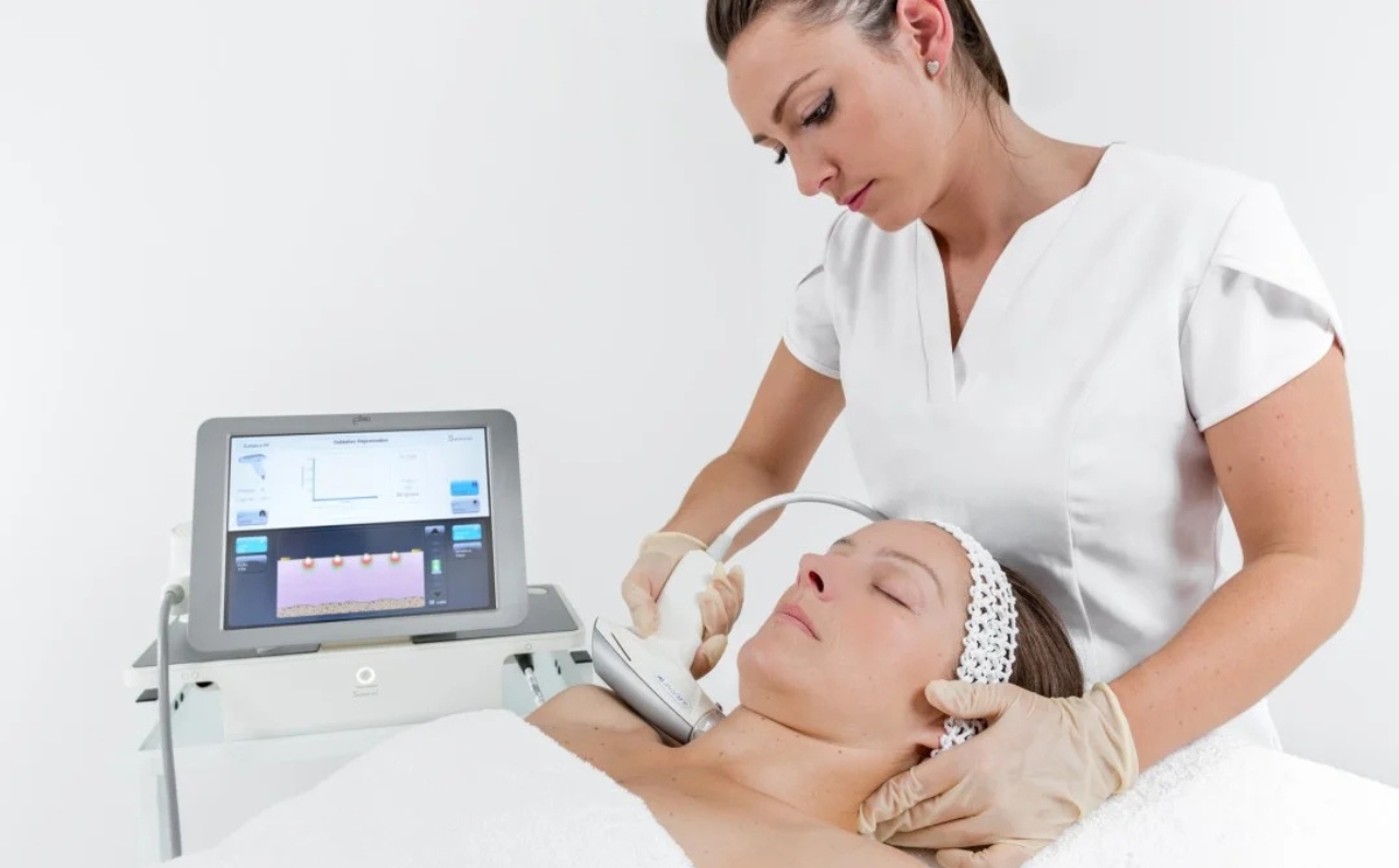 A practitioner performing the Sublative eMatrix treatment on a patient, showcasing advanced skincare technology for enhanced results.