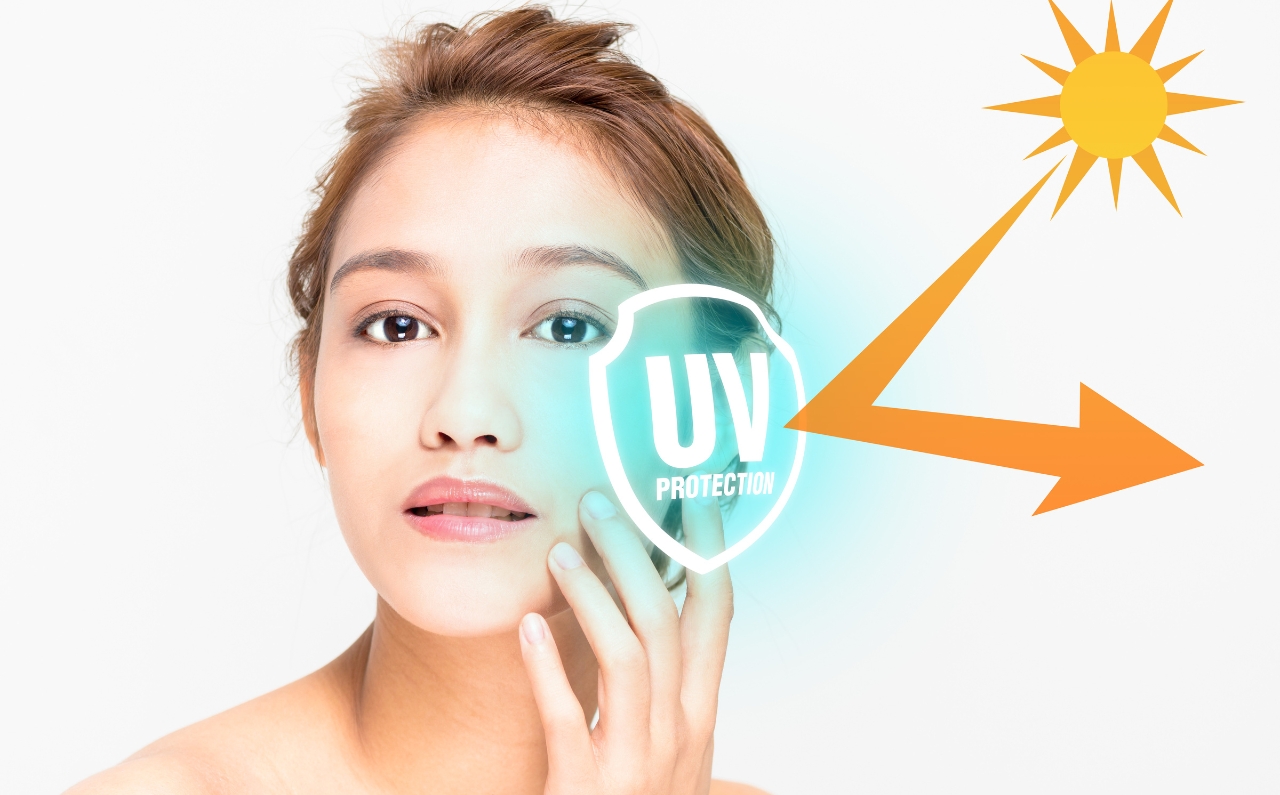 A UV shield bouncing off sun rays from a woman's skin, illustrating the importance of daily sun protection.