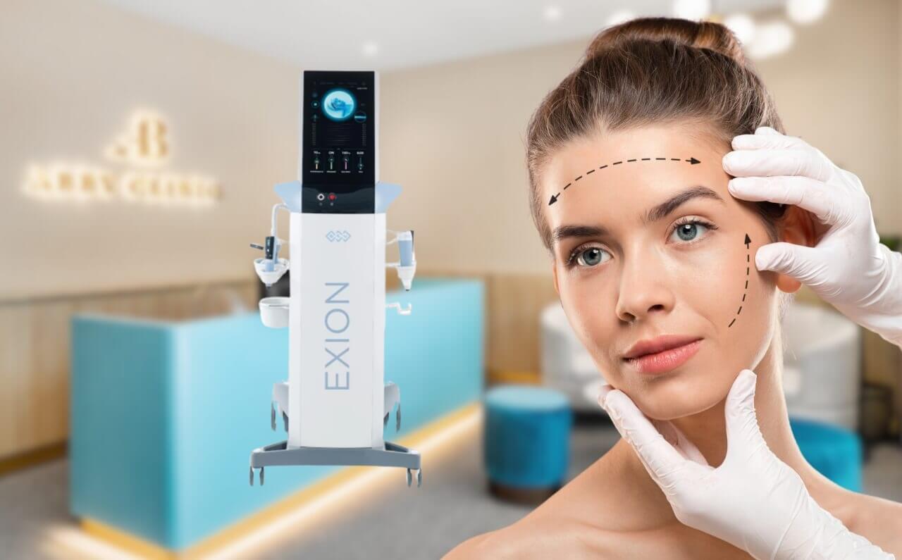 An aesthetician examining a woman's face with the BTL Exion device in the background at Dr Abby Clinic, showcasing a professional and modern clinic environment.